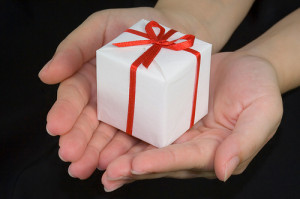 Image of hands offering a gift